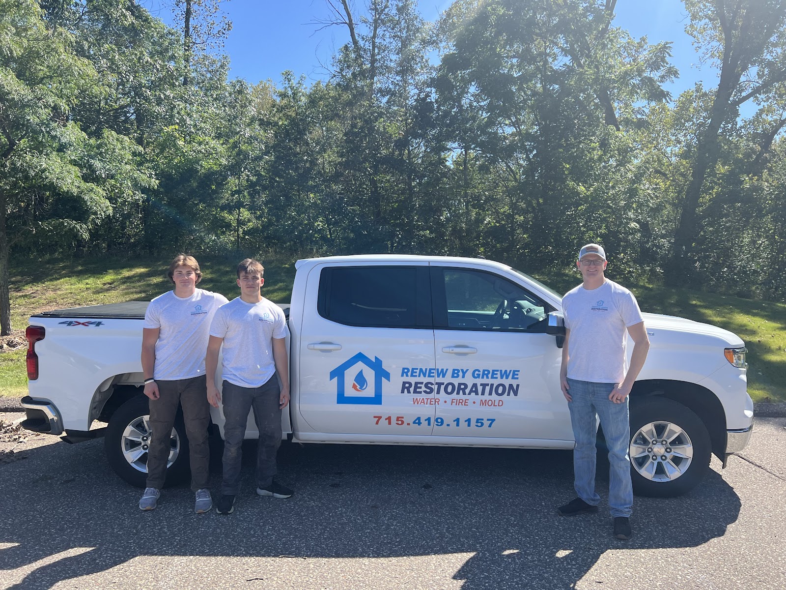 Brady Grewe and his team standing in front of the Renew by Grewe restoration truck
